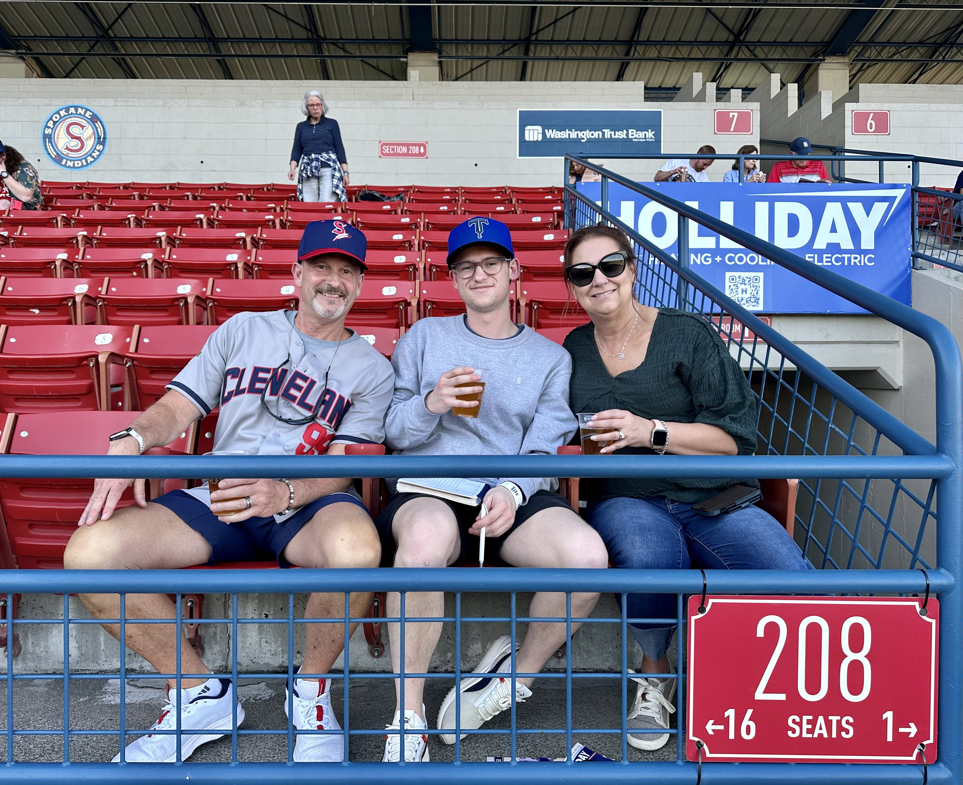 Will at a baseball game with his mother and father